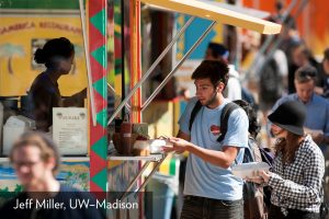 Young man buying food at a food truck