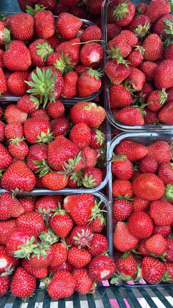 Strawberries in green berry baskets